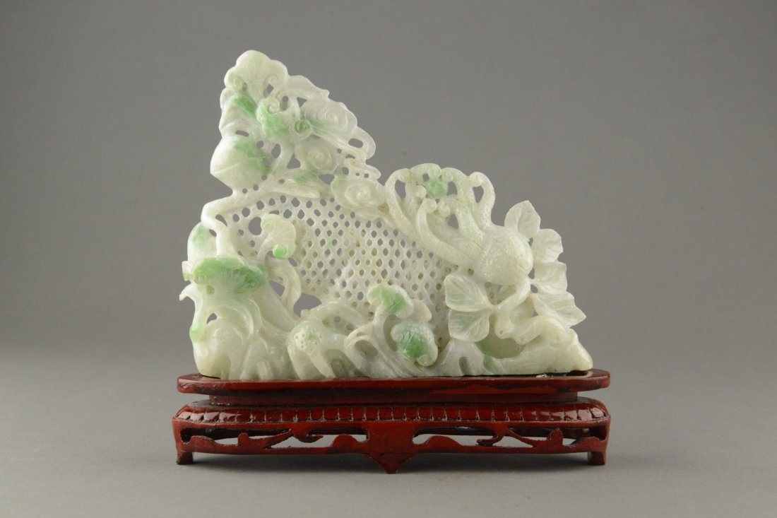 Very Fine Chinese Burma Jadeite Open Work Lingzhi: Chinese carved Burma jadeite, carved with auspicious peaches, Buddha?s hand fruit, bats, lingzhi and perforated bean. Resting on top of a wooden stand. H: 15 cm, W: 18 cm, 496 grams.