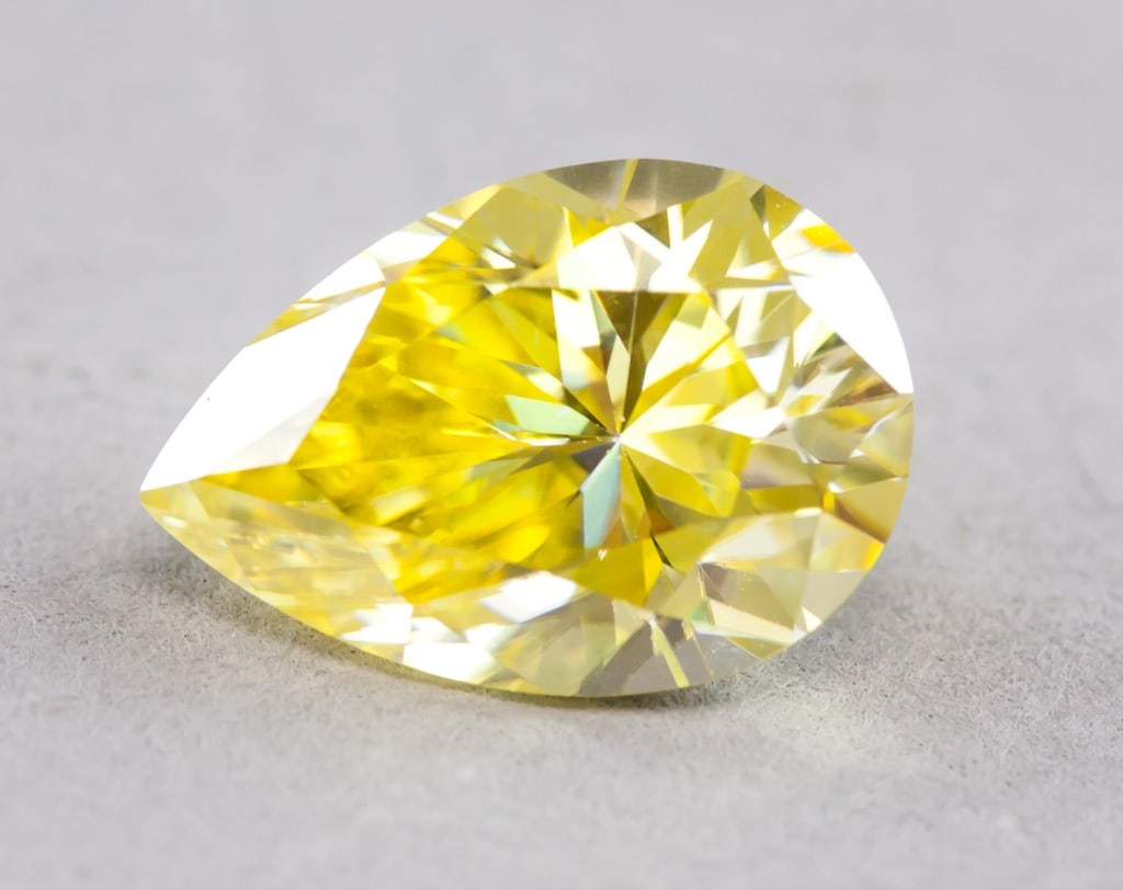 5.0ct Pear Cut Yellow VVS1 Moissanite GRA: 5.0ct pear cut yellow VVS1 Moissanite. Accompanied with a GRA certificate. 9 x 13mmCountry of Origin: Europe*Information on Tariffs on Art and Antiques:Original Artwork: Original works of art, such as