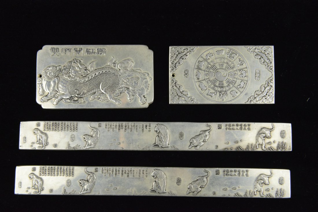 4 Pieces 560 Grams Total Silver Paper Weights: Four pieces of Chinese carved silver paper weights, featuring auspicious dragons, tigers and Chinese zodiacs with Chinese calligraphy. One marked artist name Xu Yong Chang. 17 oz, 23 cm x 10 cm.