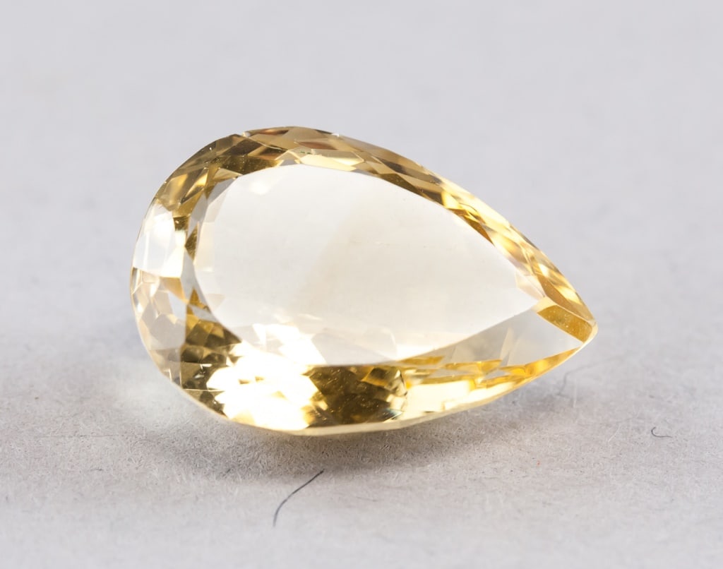12.58ct Pear Cut Yellow Natural Citrine: 12.58ct pear cut yellow natural Citrine. 19.24 x 13.46 x 8.67mm Country of Origin: Brazil *Information on Tariffs on Art and Antiques: Original Artwork: Original works of art, such as paintings, drawi
