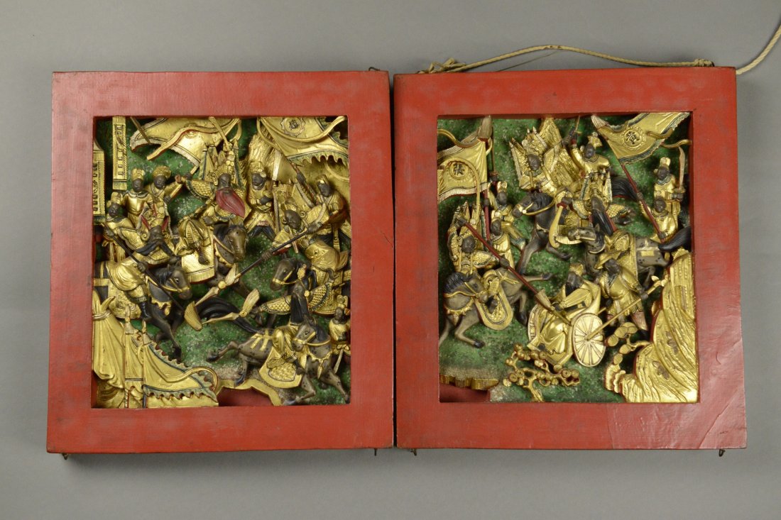 Pair of Chinese Gold Wooden Panel Carved Warriors: Pair of Chinese gold wooden panel, featuring group of warriors painted gold, brown and cinnabar red against green ground. With cinnabar red frame. 33 cm x 30 cm.
