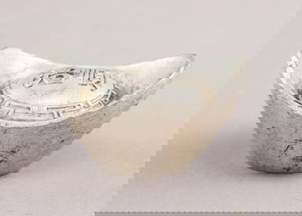 Antique Qing Treasury Yuanbao Ingot: This antique silver Yuanbao ingot from the Qing Dynasty features a boat-shaped design with raised edges and traditional Chinese inscriptions on its upper surface. The patina and wear indicate its age.
