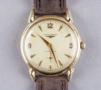 Vintage Longines Men's 10k Gold-filled Watch: Longines men’s wristwatch in 10k gold-filled case with a rectangular silver-tone dial, applied gold-tone baton hour markers, and matching gold-tone hands. Manual wind movement housed in a snap-back