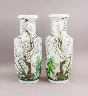 Chinese Wucai Porcelain Vases w/ Kangxi Mark 2pc: Pair of Chinese Wucai porcelain vases, each of baluster form with waisted neck and flared mouth, decorated in underglaze blue and overglaze enamel with figural scenes in garden settings, interspersed