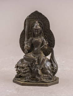 Chinese Old Bronze Carved Manjushri Sculpture: Chinese Bronze Manjushri Sculpture depicting the Bodhisattva seated in dhyanasana on a recumbent lion atop a shaped pedestal base. The figure holds a sword upright in the right hand and a scroll in th