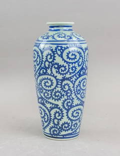 Japanese Tako Karakusa Style B&W Porcelain Vase: Japanese blue and white porcelain vase in the Tako Karakusa style, featuring an elongated body with narrow neck and flared rim. Decorated with continuous octopus scroll motifs rendered in cobalt blue