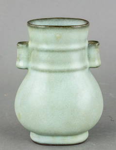 Chinese Song Era Ru Ware Porcelain Hu Vase: Chinese Song Dynasty Ru Ware Porcelain Hu Vase, featuring a rounded body, narrow neck, and slightly flared rim with twin lug handles. The vessel is covered in a pale blue-green celadon glaze with fine