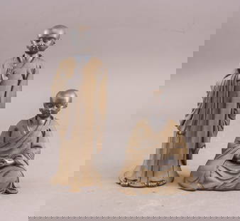 Chinese Yixing Zisha Carved Buddha Sculptures 2pc: Pair of Chinese Yixing Zisha Carved Buddha Sculptures, each finely modeled from traditional Zisha clay. One figure stands with a raised hand in a gesture of blessing, while the other is seated in medi