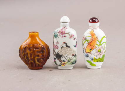 Chinese Porcelain Snuff Bottles 3pc: Chinese Porcelain Snuff Bottles, 3pc: Group of three porcelain snuff bottles, each with distinct decoration and form. Includes one brown bottle with carved Chinese characters, one white bottle painted