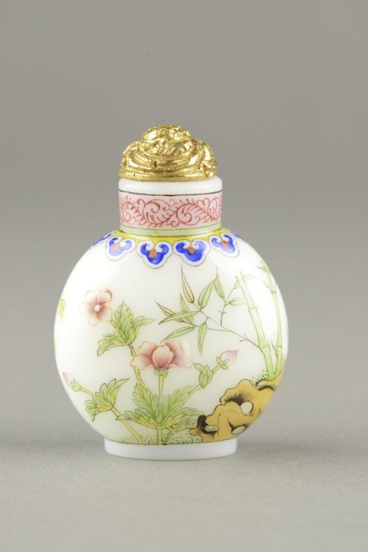 Enameled Painted Glass Snuff Bottle w Qianlong Mk: Chinese milky glass snuff bottle, richly enamel painted with auspicious flowers and bamboo. Neck painted ruyi heads and floral sprays. With gilt cap. Four characters Qianlong mark on base. H: 5.5 cm, 