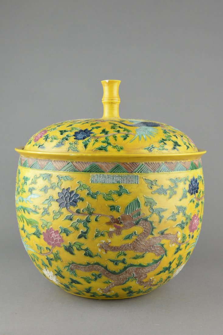 Chinese Yellow Ground Porcelain Pot w Qianlong Mk: Chinese Famille Rose porcelain pot with lid, of robust body painted with enamel with phoenix and dragon, body marked with six character Qianlong mark. H: 30 cm, D: 25 cm.