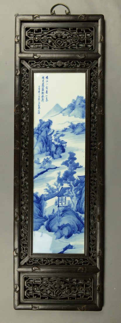 Wood Framed Chinese Blue & White Porcelain Plaque: Chinese blue and white porcelain plaque in wooden frame, featuring mountain scenes with poem signed by Zhu Shan Ba You with artist seal, framed in open works frame carved auspicious Fu bats, sprigs, b