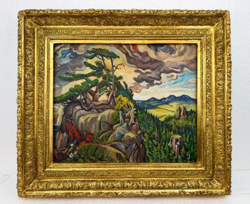 OOC Signed Arthur Lismer '45 Laing Art Galleries: Oil on canvas, framed. Attributed to Arthur Lismer (1885 - 1969). The composition presents a dramatic terrain with red foliage in the foreground, tall conifers along a cliff edge, and a distant plain