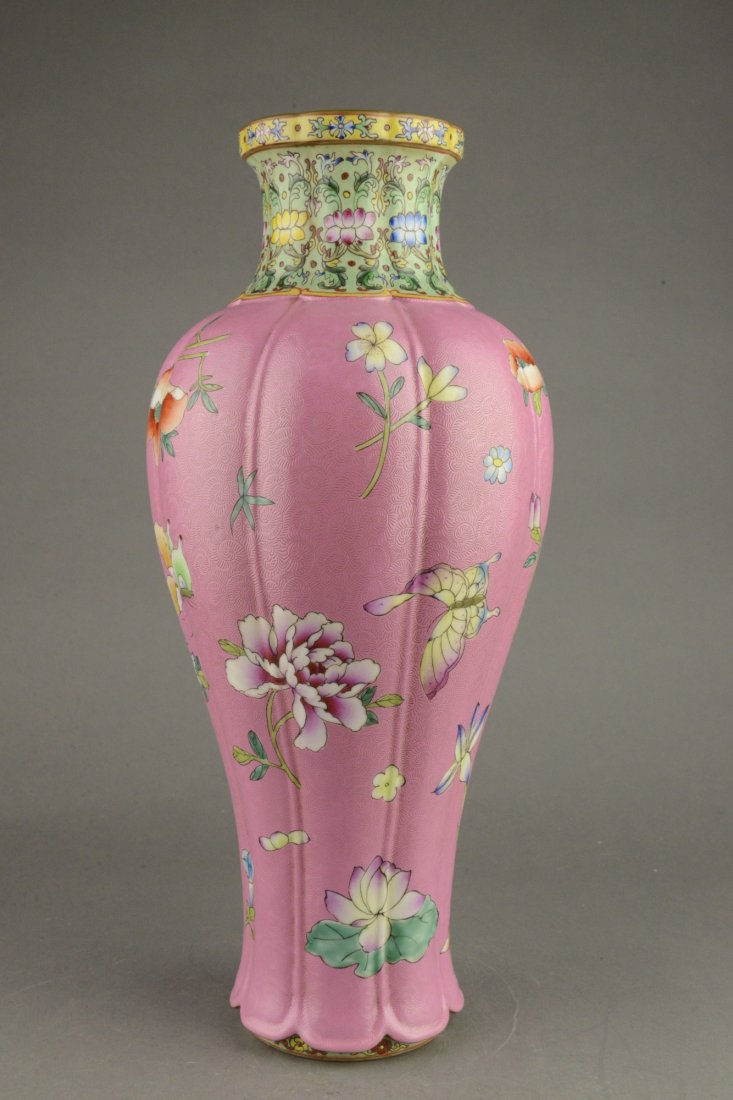 Famille Rose Pink Ground Vase Yongzheng Mark: Chinese Famille Rose pink ground porcelain vase, of lobed baluster form, finely painted with auspicious flowers and butterfly against pink Sgrafitto ground, neck flanked with floral sprays on turquois