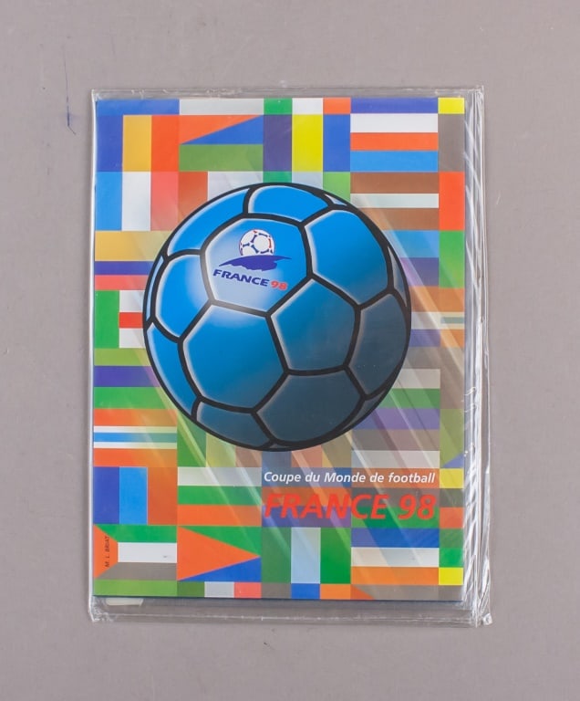 1998 France FIFA World Cup Stamp Folder: 1998 France FIFA World Cup stamp book, complete with commemorative stamps issued for the tournament. Includes illustrated booklet cover and two stamp panels featuring dynamic designs of football playe