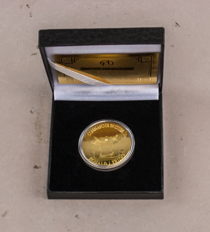 2024 Donald Trump The Revenge Tour 24K Gold Coin: 2024 commemorative 24K gold-plated coin featuring Donald J. Trump, housed in black presentation box with certificate. Obverse displays profile portrait with inscriptions “THE REVENGE TOUR,” ��