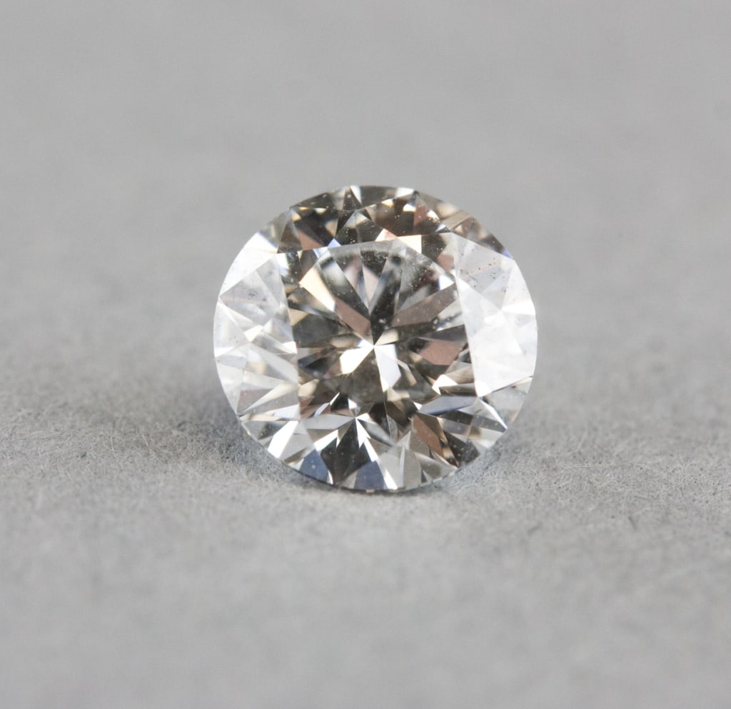 1.03ct VS1 Laboratory Round Diamond w/ IGI Report: Laboratory-grown diamond certified by the International Gemological Institute (IGI), report no. LG739513432, dated October 1, 2015. Round brilliant-cut measuring 6.47–6.50 × 3.99 mm, weighing 1.03