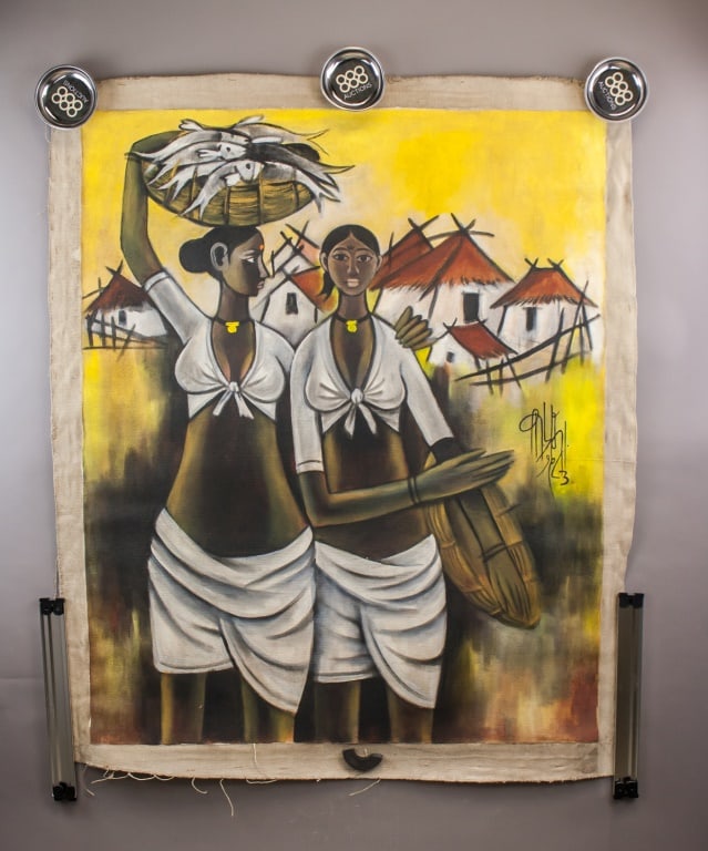 Indian Oil on Canvas Signed B. Prabha: Oil on canvas. Depicting two standing female figures in white garments carrying baskets within a village setting, shown against stylized huts and a yellow-toned sky. The composition is rendered in a s