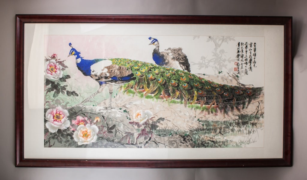 Chinese WC on Paper Signed Wu Yisheng w/ Red Seals: Watercolor on paper, framed. Depicting two peacocks standing on a rocky outcrop surrounded by blooming peonies in pink, white, and yellow tones. The birds are rendered with detailed plumage in green,