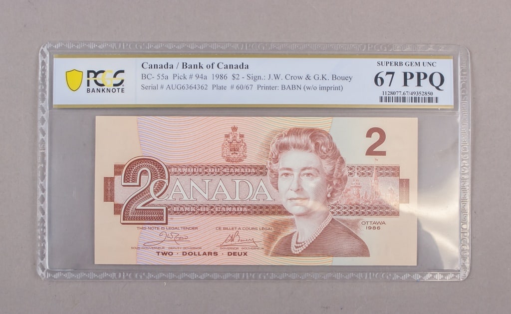1986 Canada $2 Banknote Special # 67PPQ PCGS: A 1986 Bank of Canada two-dollar note, serial AUG6364362, printed by BABN without imprint and signed by Crow and Bouey, certified and encapsulated by PCGS Banknote as Superb Gem Unc 67 PPQ. The holder