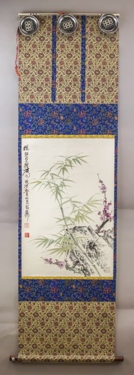 WC & Ink on Paper Signed Xie Zhiliu w/ Provenance: Watercolor & ink on paper, hanging scroll. This artwork masterfully executed with fine brushwork detailing bamboo and flowering branches. This piece is elegantly mounted on silk brocade for display as