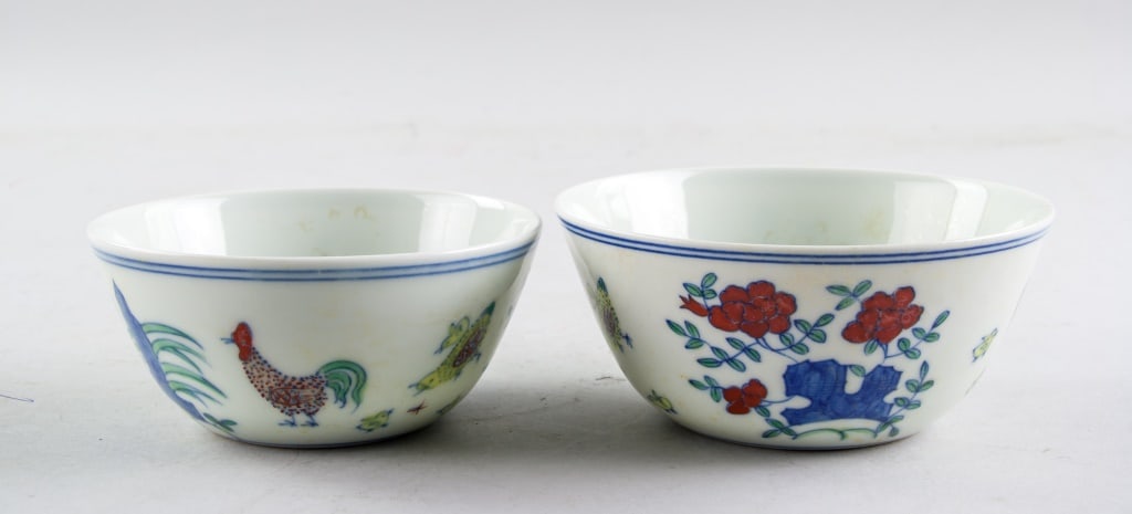Chinese Doucai Porcelain Cups 2pc Ming Chenghua MK: Chinese doucai porcelain cups, 2pc. Rounded edge tapering to bottom, painted with rooster and rock, six-character Ming dynasty Chenghua mark on base, 5 x 10.5-12 cm, 209 grams