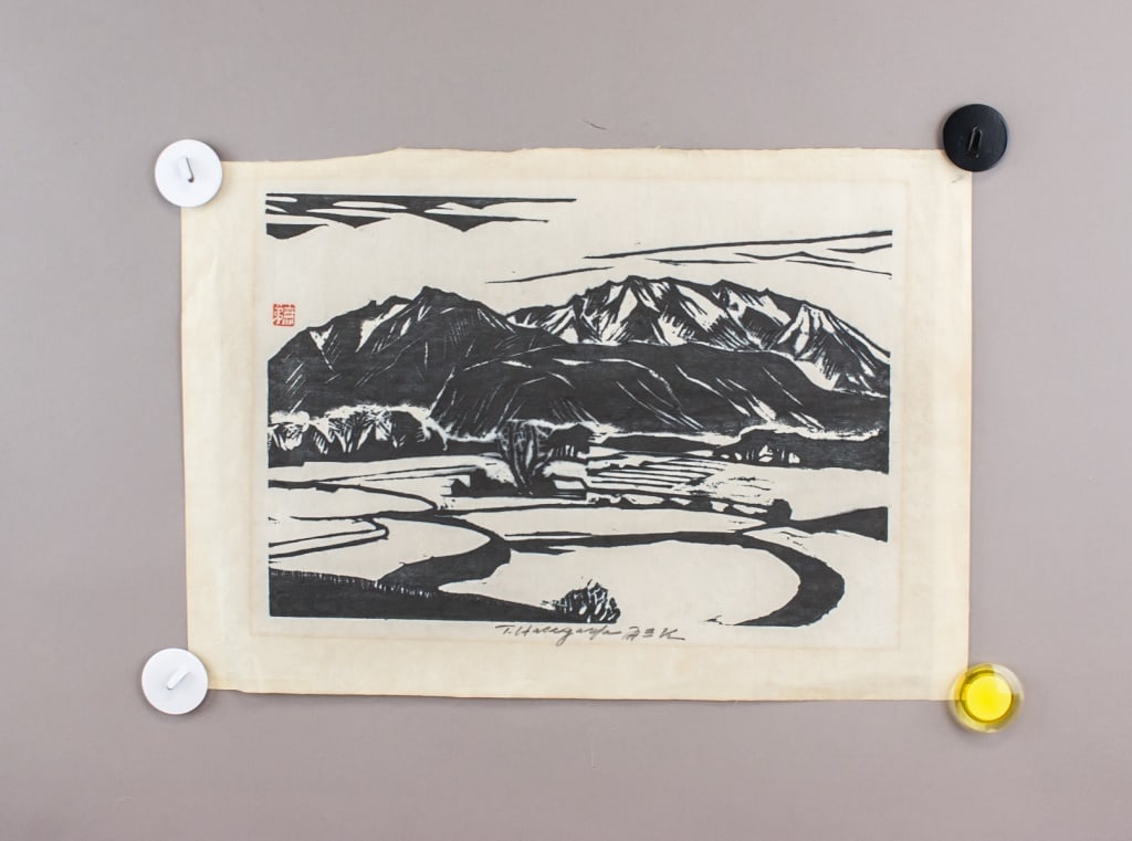 Japanese Woodblock Print on Paper T. Hasegawa: Japanese woodblock print on paper. Featuring landscape with mountain range in background. Signed "T. Hasegawa" beneath the image in the center. Inscribed with one seal. 31 x 45 cm. Provenance: