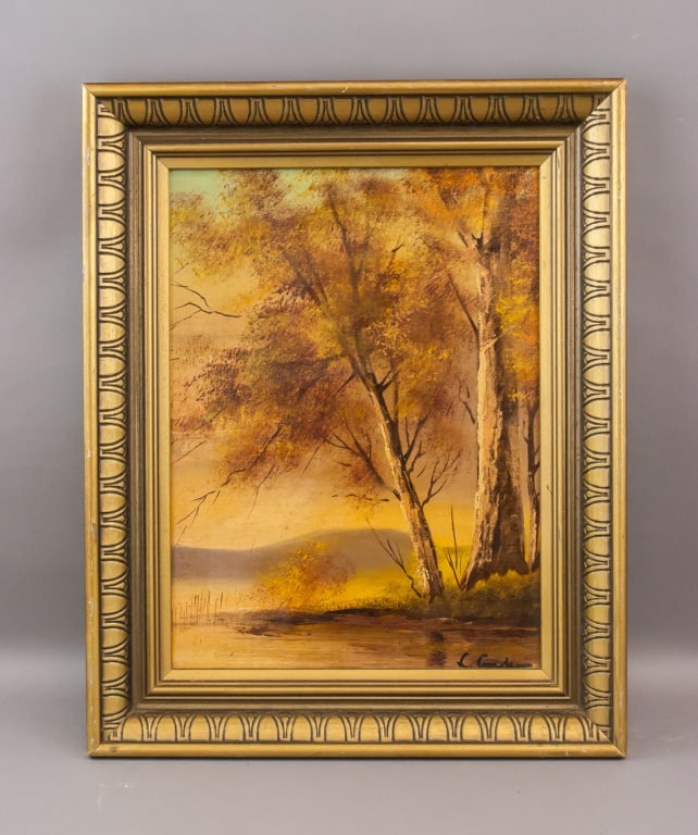 American Oil on Canvas Signed L. Carter: Oil on canvas, framed. Depicts a tranquil autumn landscape with tall trees in golden foliage beside a reflective body of water, backed by rolling hills and a warm sky. Signed L. Carter on bottom right