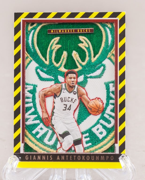 2023 Panini Giannis Antetokounmpo Jersey Card: 2023 Panini Threads Basketball Giannis Antetokounmpo jersey patch card, No. 188, featuring a prominent Milwaukee Bucks logo jersey swatch (not verified) and full-color action image of the player. Reve