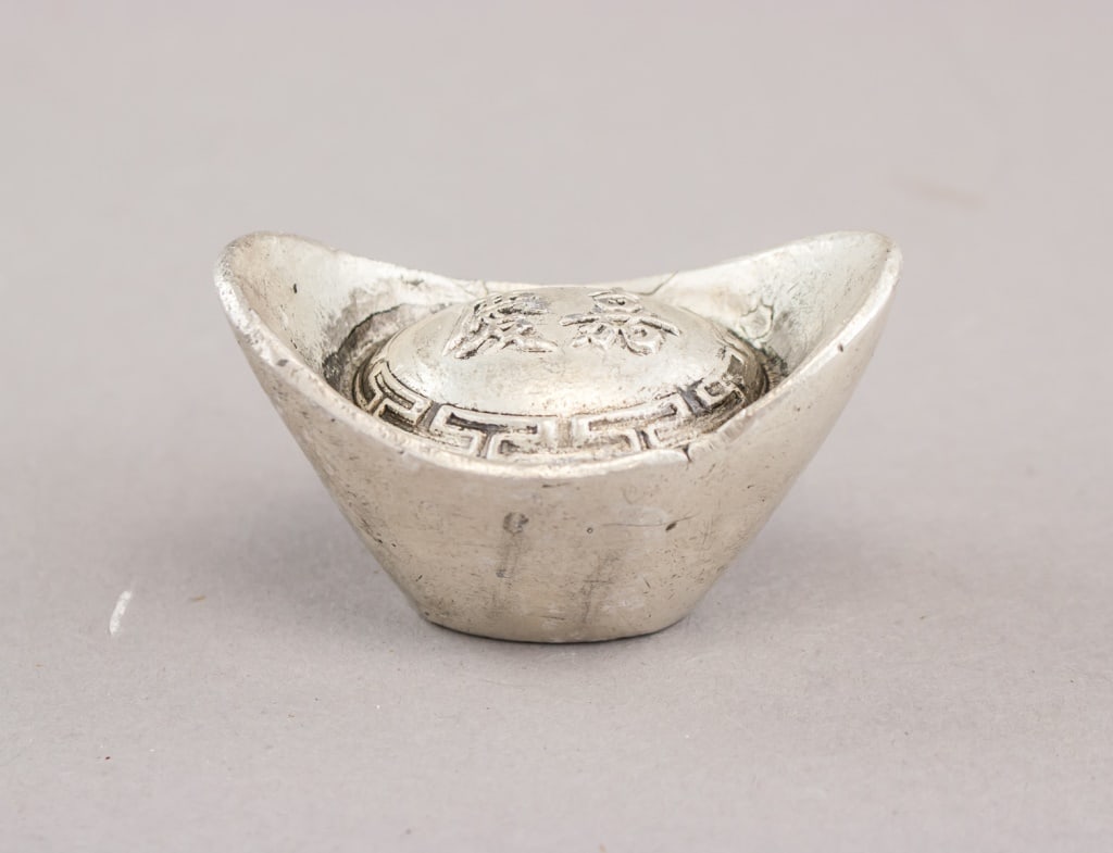 Chinese Qing Jiaqing Era Treasury Silver Ingot: Chinese Qing Jiaqing-era treasury silver ingot, a traditional boat-form sycee with raised ends, engraved Qing dynasty mint marks and hallmark inscriptions characteristic of late-18th to early-19th-cen