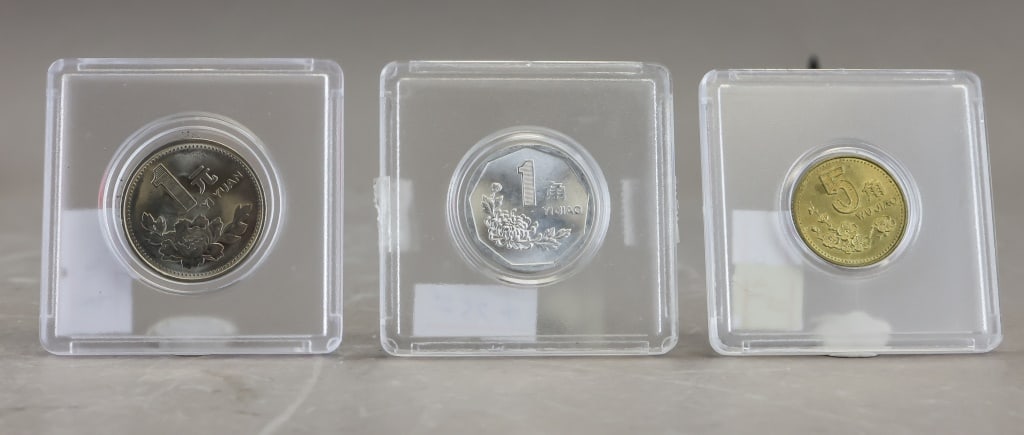 1990s China Coins 3pc: 3-piece lot, a small group of modern-era Renminbi circulation issues featuring Chinese yuan denominations across 1?Yuan, 1?Jiao, and 5?Jiao. The set shows the period?s floral-themed designs and mixed 