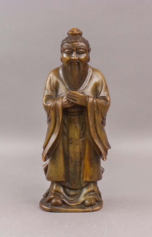 Chinese Shoushan Stone Carved Confucius: Chinese carved figure of Confucius in Shoushan stone, depicted standing with hands clasped in traditional robe. Features include topknot hairstyle, long beard, and incised character details down the f