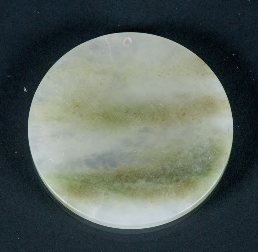 Burma Green Jadeite Carved Round Pendant: Burma green jadeite carved pendant of round form with smooth surface. Pierced for suspension, D: 6 cm, 3.5 grams, Density 3.44