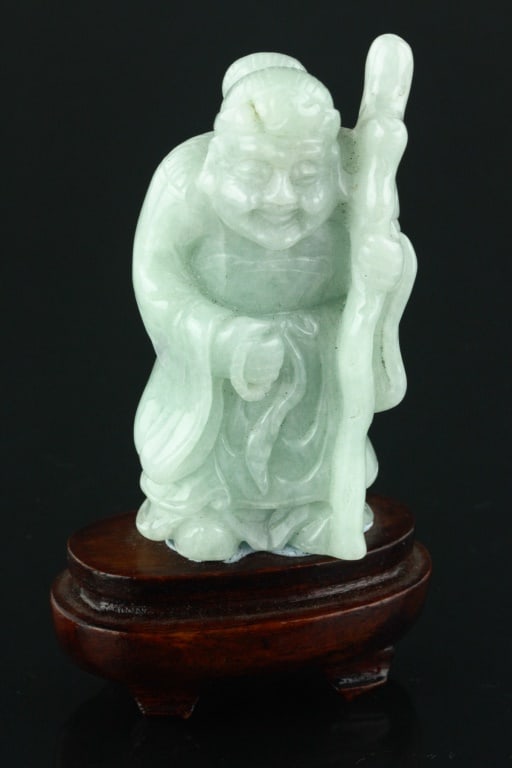 Burma Green Jadeite Carved Shou Immortal: Burma apple green tone jadeite. Featuring a standing Shou immortal; custom wood stand included; H: 9 cm, W: 4 cm, 86.20 grams