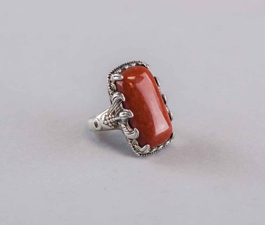 Rectangular Brown Gemstone Sterling Silver Ring: Rectangular brown gemstone sterling silver ring featuring a large polished reddish-brown rectangular cabochon set within an ornate claw-and-leaf style sterling mount, the piece showing bright metalwor