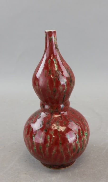 Chinese Flambe Gourd Vase Qianlong mark: A Chinese-style flambe-glazed double-gourd vase displaying mottled red, green, and darker tonal streaking under a high-gloss finish, formed in the traditional two-bulb gourd silhouette with narrow nec