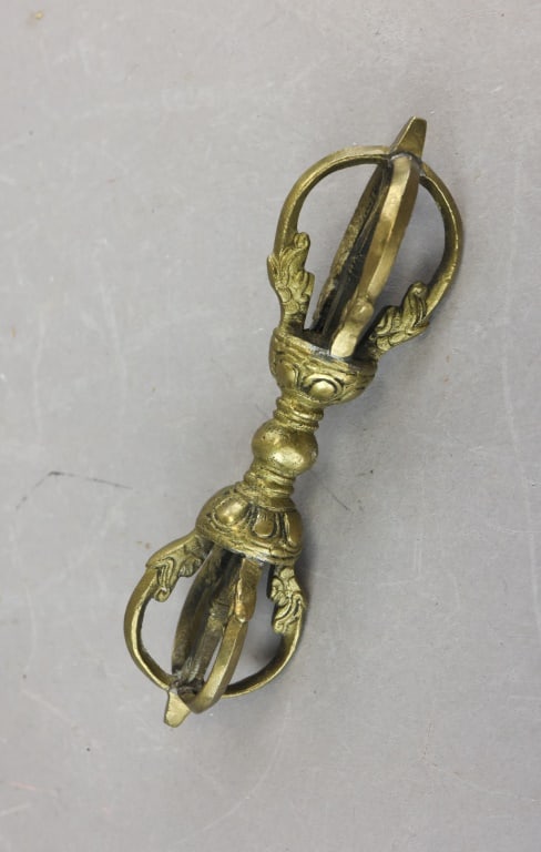 Vintage Bronze Ritual Vajra Dorje: A bronze ritual vajra (dorje) rendered with a high level of detail: the central spherical knop is flanked by two identical four-pronged ends, each prong deeply modeled with layered leaf-form ridges an