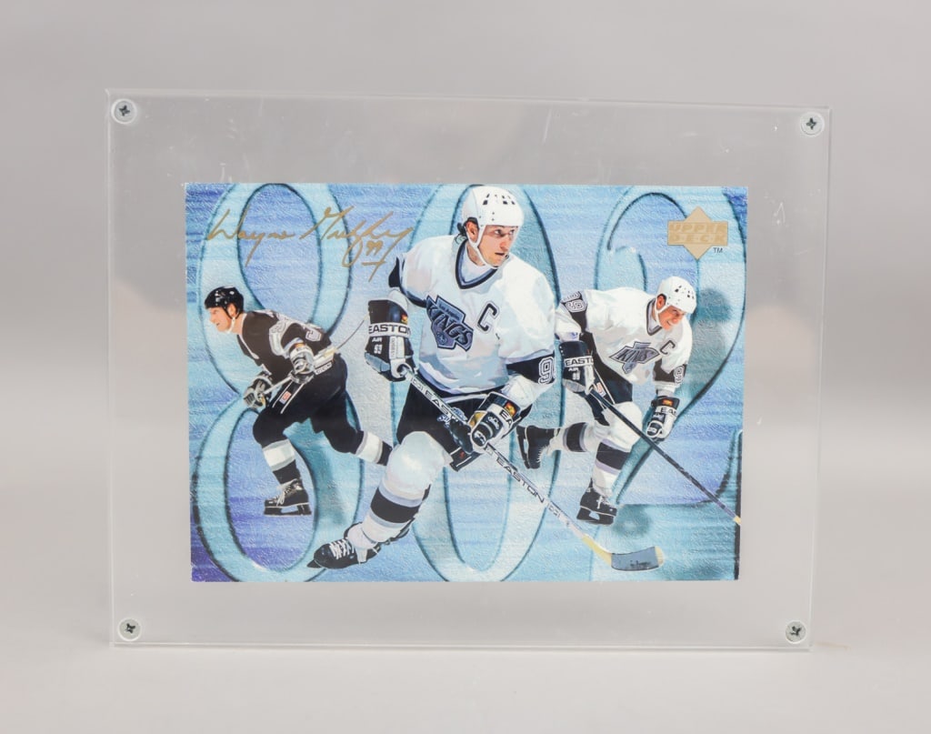 1994 Upper Deck Framed Large Card Wayne Gretzky: A commemorative Upper Deck hockey card showcasing Wayne Gretzky in multiple Los Angeles Kings action poses against a blue gradient backdrop with his iconic 99 prominently displayed, gold printed auto 