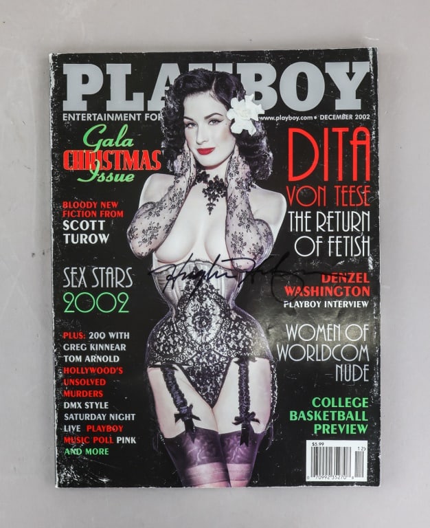 2002 Playboy Magazine Signed Hugh Hefner: A December 2002 Playboy magazine issue offered with a front cover featuring the ?Gala Christmas Issue? design and a clear Hugh Hefner signature across the cover, including standard publication identif