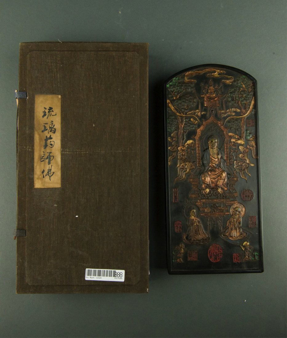 Fine Gilt Ink Stone Carved Buddha & Scripts Sealed: Fine Chinese gilt ink stone, rectangular form, richly carved with Buddha on front and Buddhist scripts on verso, with multiple seals. With case. H: 25 cm, W: 11.5 cm, 833 grams. Provenance: T. Ng Coll