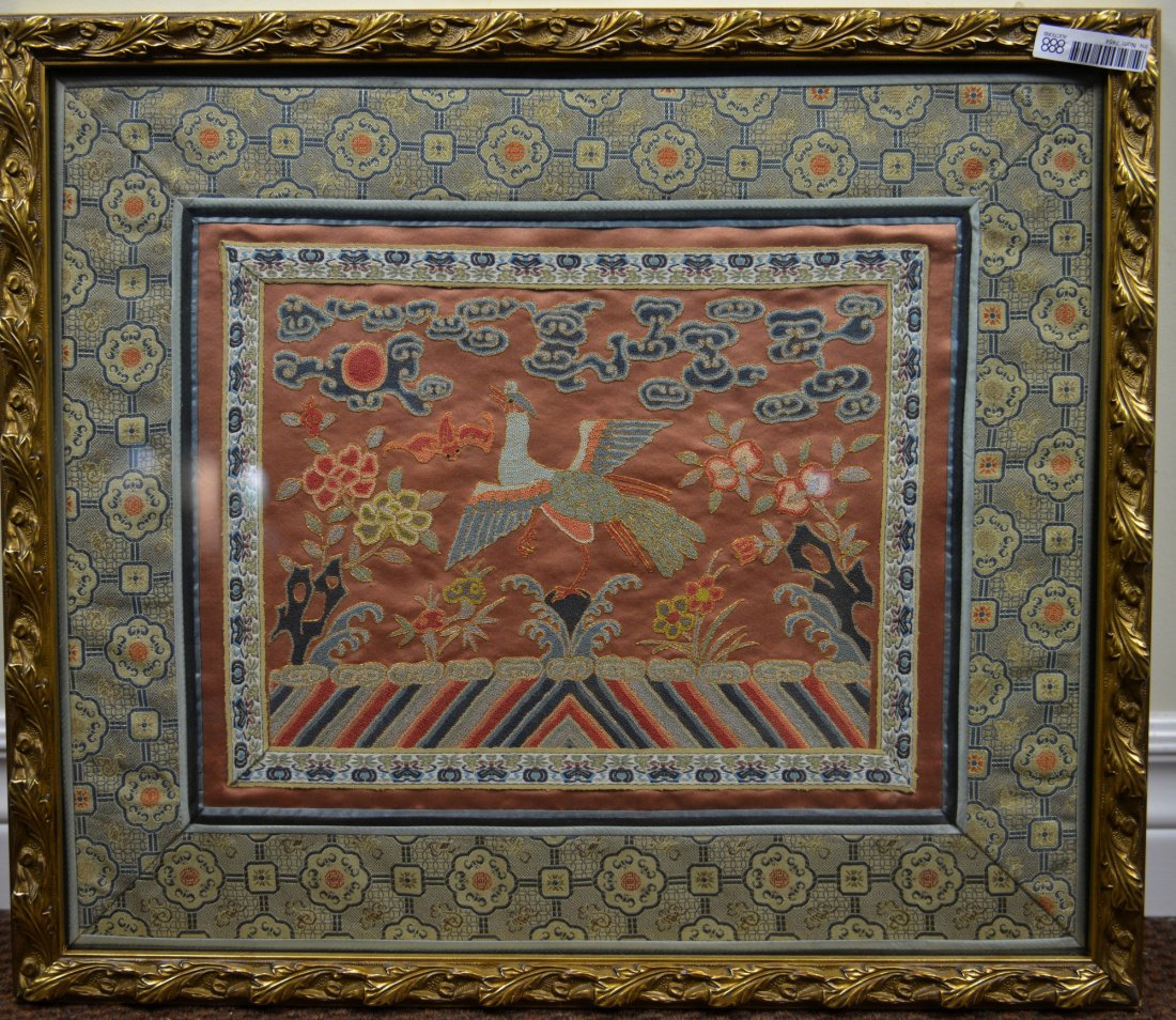 Chinese Framed Silk Embroidery: Chinese silk embroidery of phoenix with lingzhi clouds. Matted by embroidered pattern of bats and Shou symbols. Framed. H 40 cm, W 48 cm