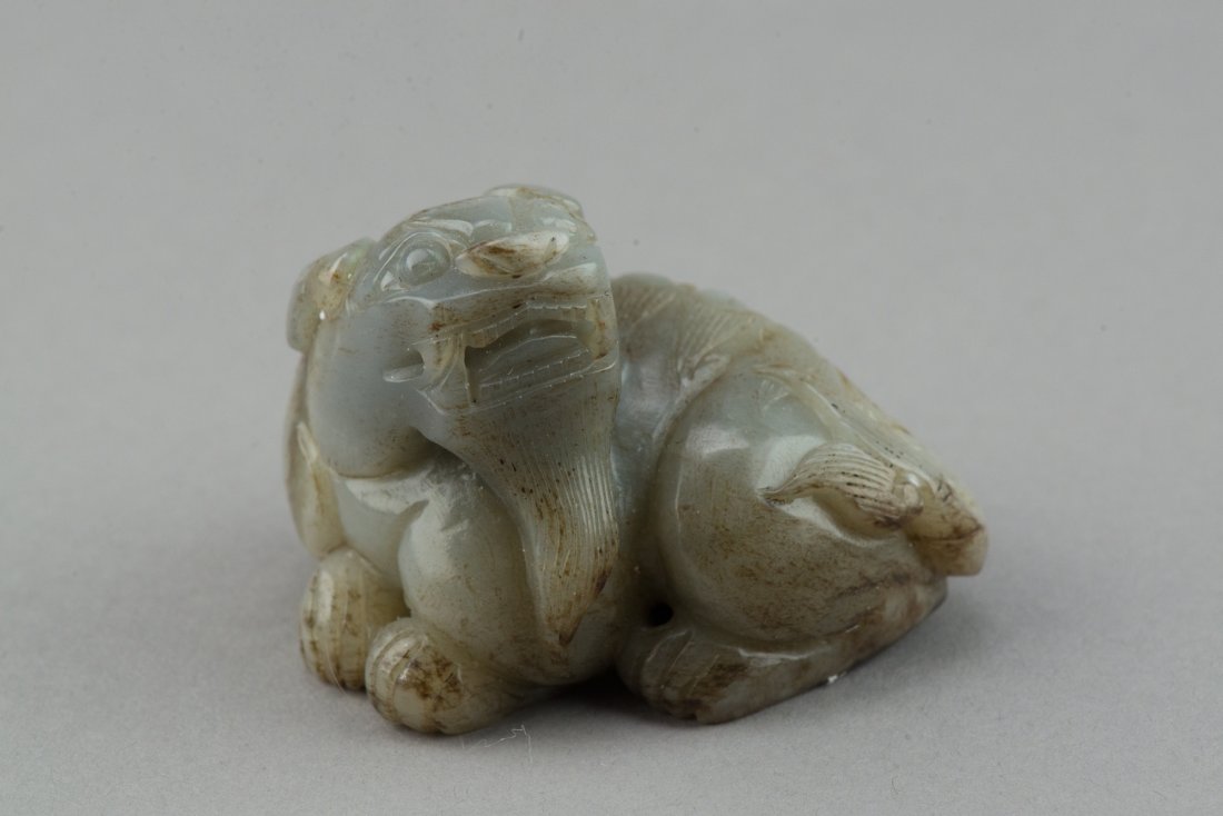 Fine Chinese White Jade Carved Dog: Fine Chinese white jade carved dog. H: 6 cm, W: 8 cm, 263 grams. Provenance: T. Ng Collection Toronto.
