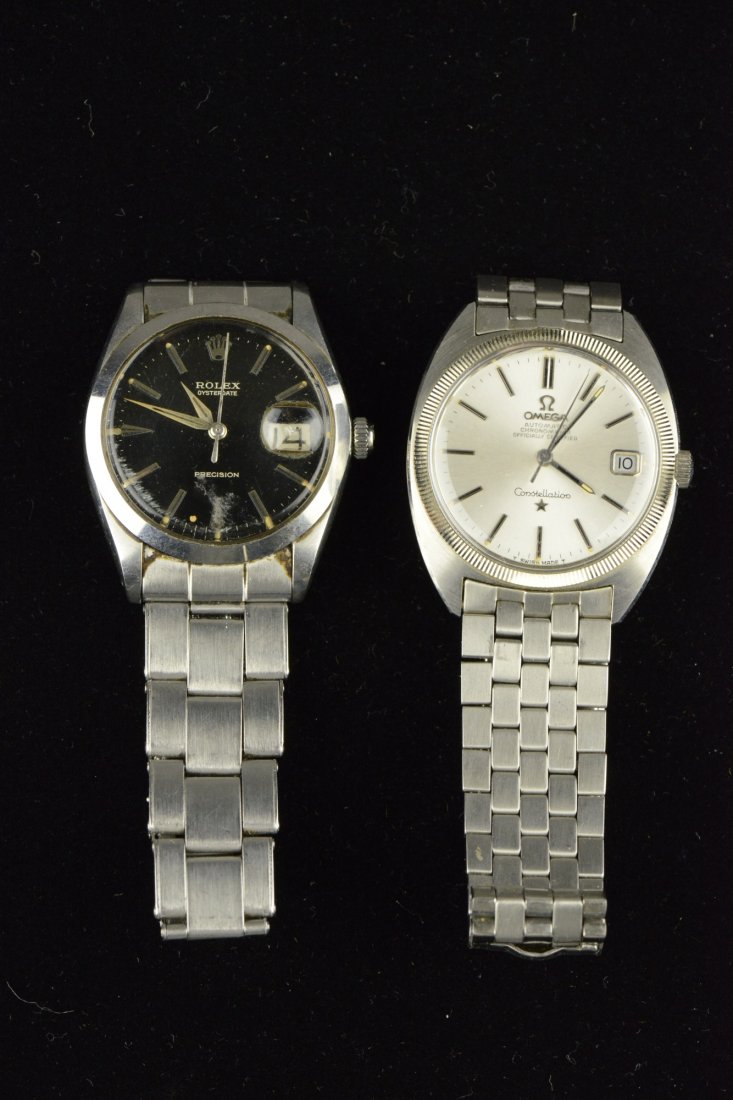Two Men's Classic Watches - Omega and Rolex 1970s: Classic and refined, Two pieces of fine men's pre-owned watch. First of Rolex Precision Oysterdate manual wind stainless steel watch. Second of Omega Constellation automatic chronometer watch. Total 1