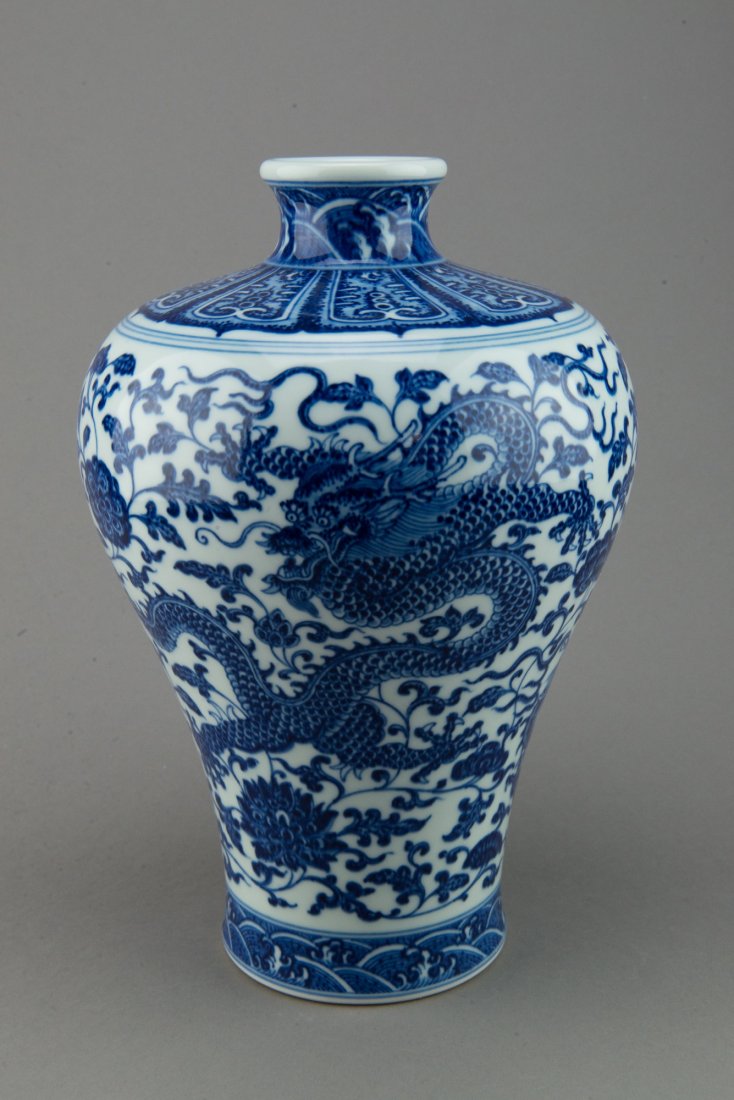 Fine Chinese Blue & White Dragon Meiping Qianlong: Chinese blue and white porcelain Meiping vase, richly painted with two antithetical dragons amidst lotus decorated ground, the base marked with six-characters Qianlong mark. H: 31 cm, D: 11.5 cm.