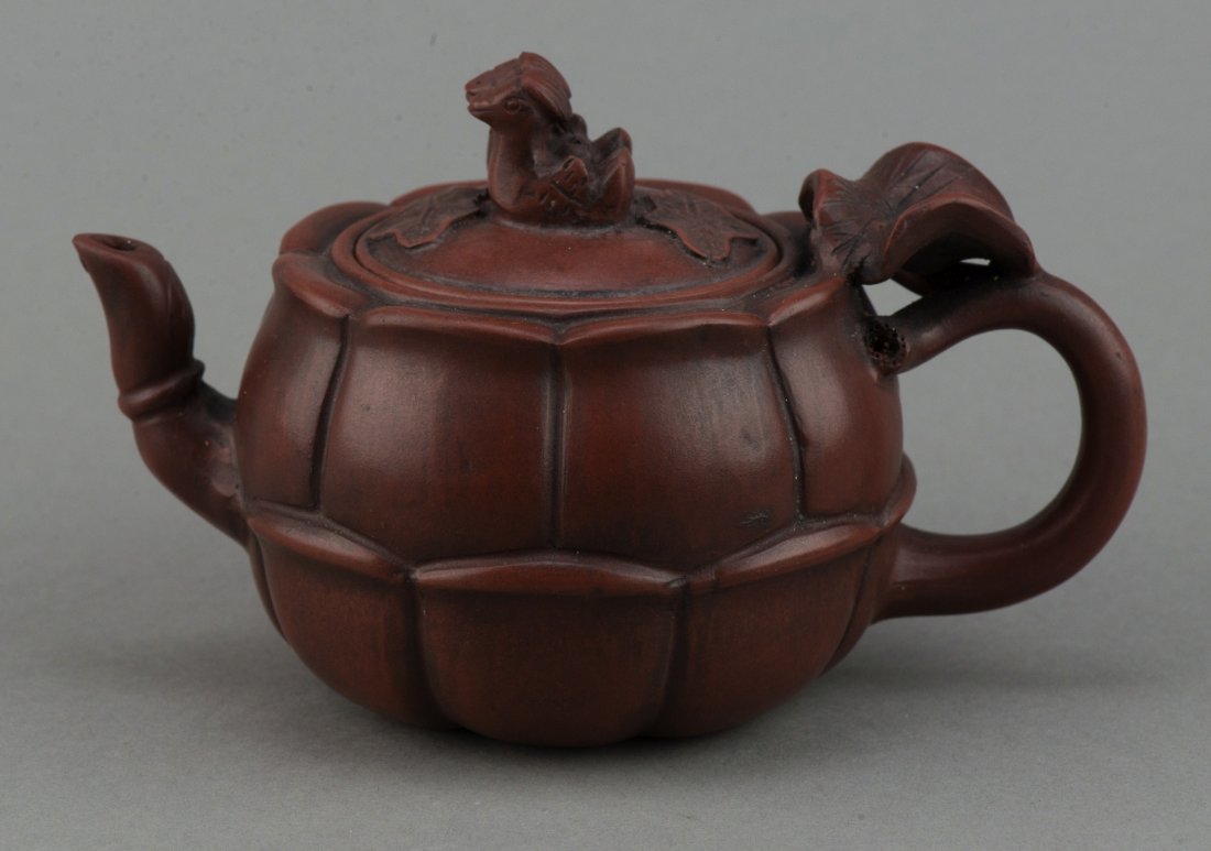 Chinese Yixing Zisha Teapot Signed Gu Jin Zhou: Chinese Yixing Zisha teapot, of lotus flower form, flanked with lotus leave and pair of mandarin ducks, under lid and bottom marked Gu Jin Zhou stamp seal. H: 10 cm, W: 17 cm, 365 grams.
