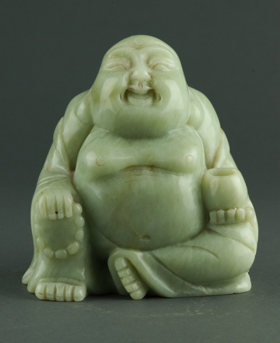 Fine Chinese Celadon Jade Carved Buddha Figure: Fine Chinese celadon jade carved figure, featuring seated laughing Buddha holding Buddhist beads. H: 14 cm, W: 12.5 cm, L: 7 cm, 1922 grams. Provenance: T. Ng Collection Toronto.