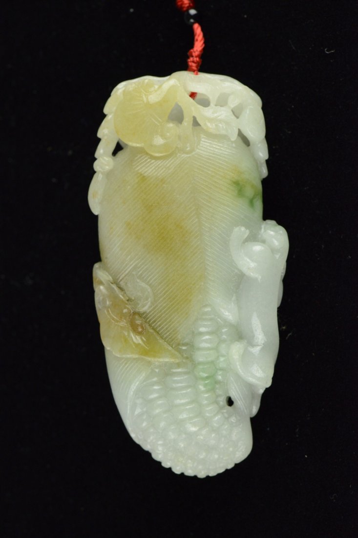 Very Fine Celadon Jadeite Carved Corn Pendant: Chinese jadeite carved pendant, of celadon colour with yellow suffusions, carved as a corn with auspicious bats and bixie. H: 8 cm, W: 4 cm, 94 grams.