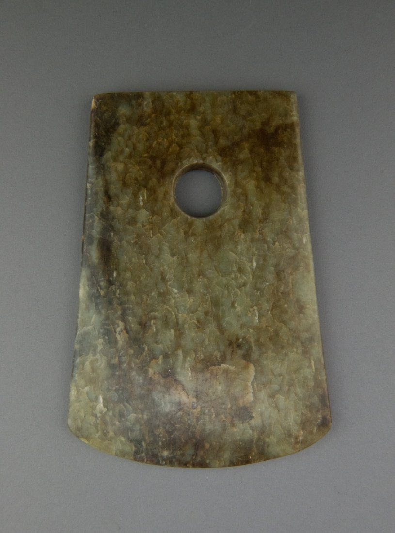 Chinese Jade Carved Axe Blade: Chinese jade carved axe blade. H: 18 cm, W: 12 cm, 377 grams.