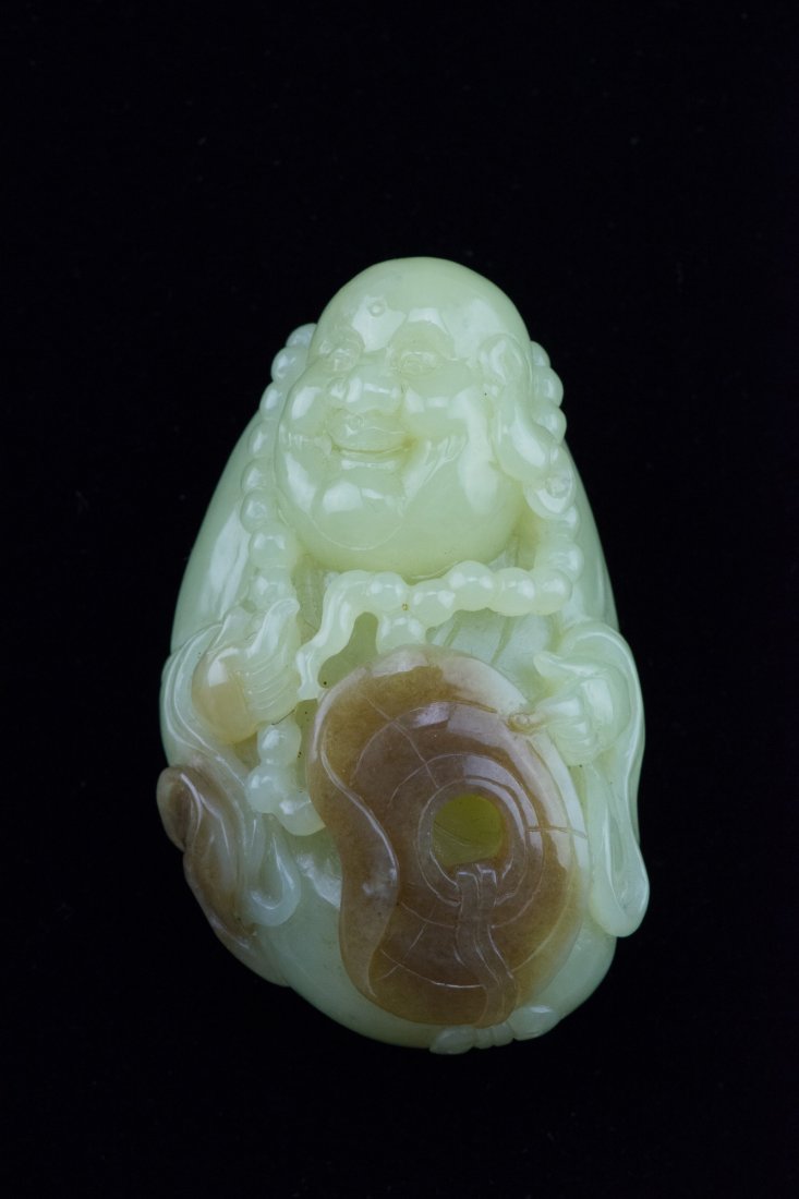 Chinese Celadon Jade Pebble Carved Buddha: Chinese brown-skinned celadon jade pebble, carved a happy Buddha with Buddhist prayer beads. H: 7.7 cm, W: 4.7 cm, 179 grams. Provenance: T. Ng Collection Toronto.