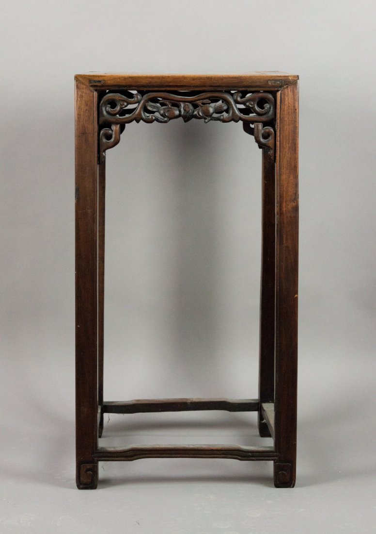 Chinese Huanghuali Rectangular Corner Leg Stool: Chinese Huanghuali rectangular corner leg stool, apron piece carved with auspicious fruits and vines, legs joined by stretchers. 76 cm x 40 cm.